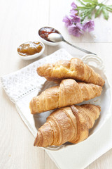 Croissants on table with jam