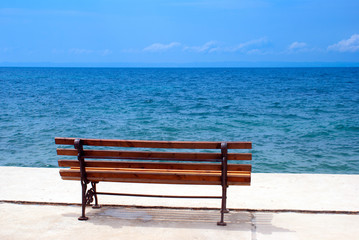 Fototapeta na wymiar metal garden chair at the beach, Greece