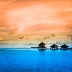 Over water bungalows with steps into amazing green lagoon