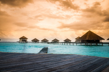 Over water bungalows with steps into amazing green lagoon