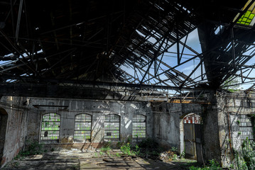 Fototapeta na wymiar Abandoned industrial interior with bright light