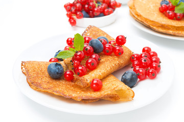 crepes with fresh berries for breakfast, isolated