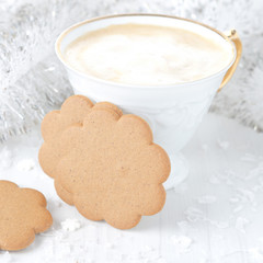 cup of cappuccino and ginger cookies