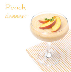 peach souffle decorated with fresh peaches, isolated