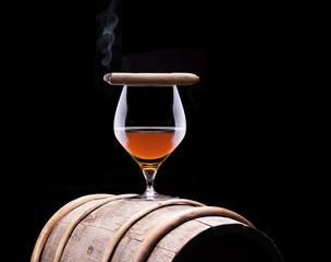 Cognac and Cigar on black with vintage barrel