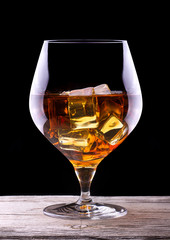 Cognac or brandy on a wooden table