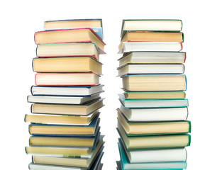 stack of books on a white background with reflection