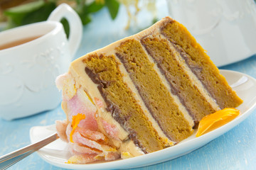Pumpkin cake with chocolate and caramel cream.