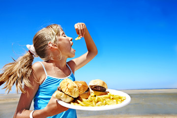 Child eating fast food.