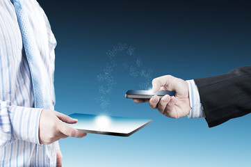 Business man holding smart phone and sending emails