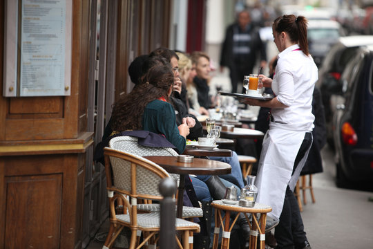 Parisians and tourist enjoy eat and drinks