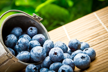 Delicious fruit berries in metal small pail