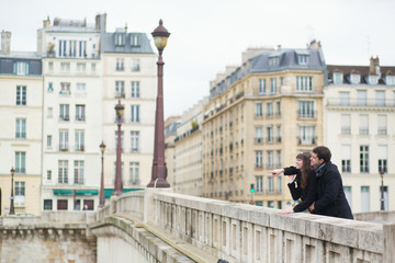 Fototapeta premium Happy couple laughing on the bridge