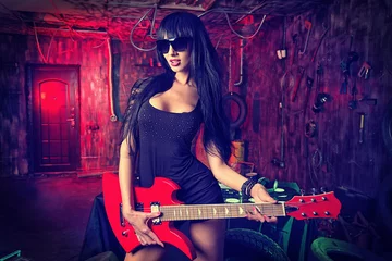 Fotobehang vrouwelijke gitarist © Andrey Kiselev