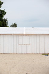 white wooden building wall on beach