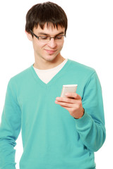 A smiling man using a mobile phone, isolated on white