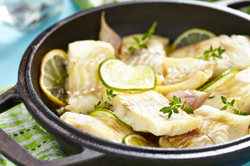 Baked fish fillet with lime and garlic