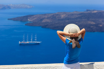 woman enjoying view of Santorini, Greece