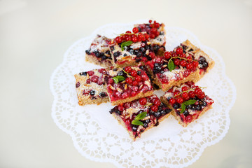 Fresh baked red and black currant berries cake