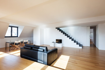 Interior, wide loft, hardwood floor, view living room