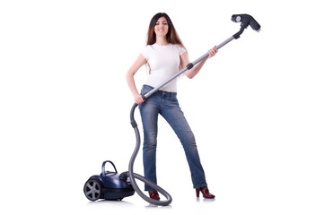 Young woman with vacuum cleaner on white