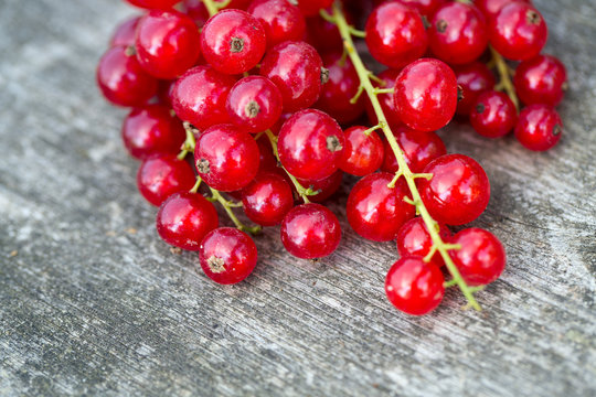 red currant on wooden background