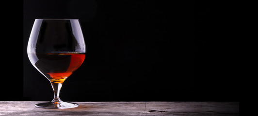 Cognac or brandy on a wooden table