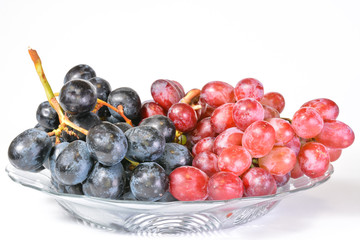 Fresh grapes in clear plate