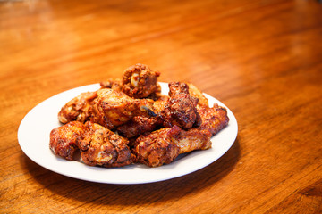 Mesquite Barbecued Wings on Wood Table