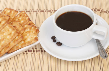 Cup of coffee and cracker