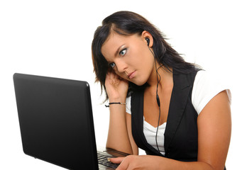 Young woman with laptop and earphones. - obrazy, fototapety, plakaty