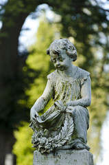 Child statue at a cemetery