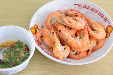 Hot steamed shrimps and seafood sauce