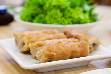 Sour pork with vegetable on the white dish