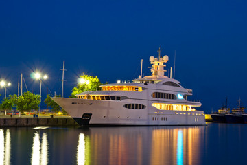 Luxury yacht in the port at night