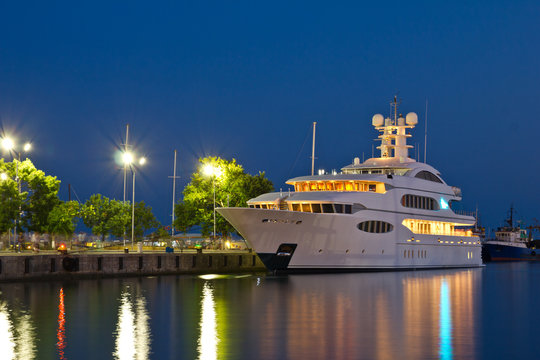 Yacht in the port at night