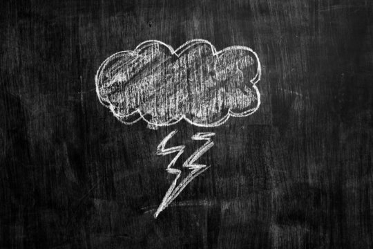 Chalk drawing of thundercloud on blacboard