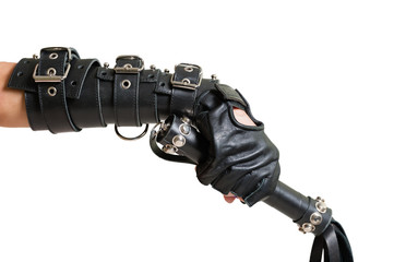 Hand in leather glove with lash