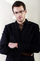 young man against a white wall
