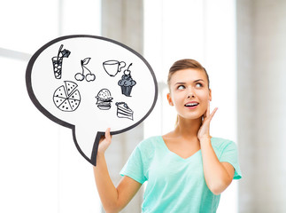 girl showing text bubble with junk food icons