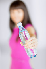 sporty woman with bottle of water