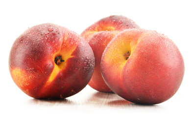 Three fresh nectarines isolated on white background