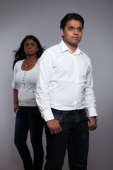 Young romantic indian couple. Wearing white shirt and jeans. Stu