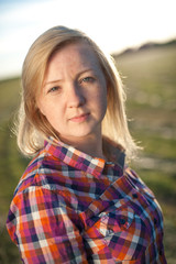 portrait of freckled blonde outside