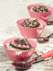 Diet chocolate cupcakes and three spoons. Macro