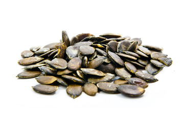 Obraz premium Pumpkin seeds on a white background