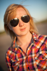 Fototapeta premium portrait of freckled blonde outside