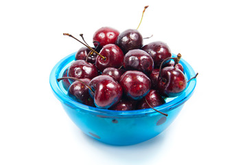 Fresh cherries in bowl isolated on white