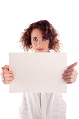 Young beautiful girl holds a empty white sign for you to fill in