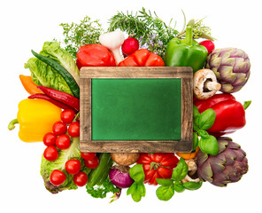 fresh vegetables and herbs with chalkboard